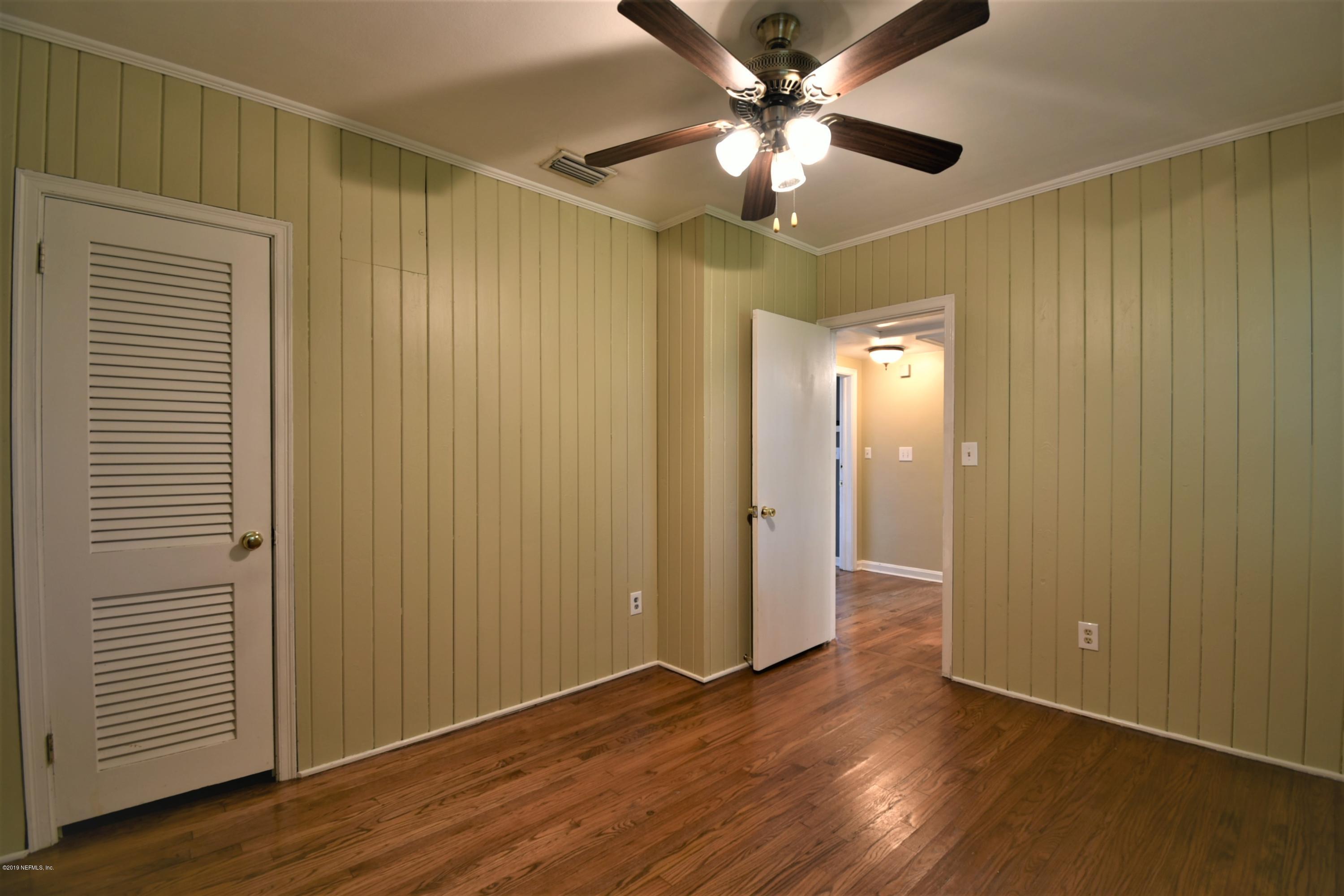 4253 Roma Boulevard Jacksonville, FL 32210 - Photo 13 of 17 a view of an empty room with wooden floor