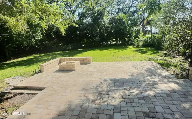 a view of a park with large trees