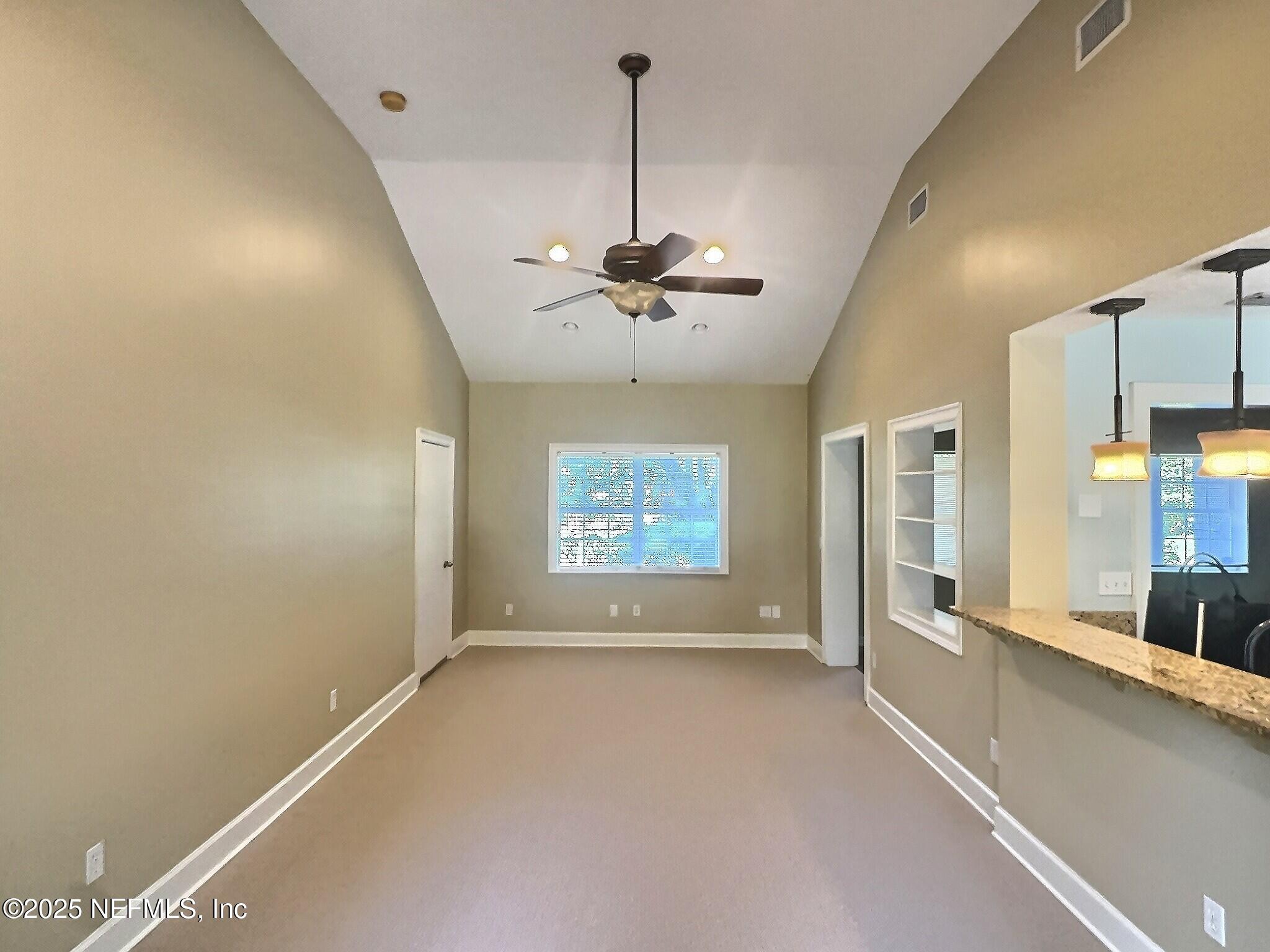 4253 Roma Boulevard Jacksonville, FL 32210 - Photo 7 of 17 a view of room with window and a ceiling fan