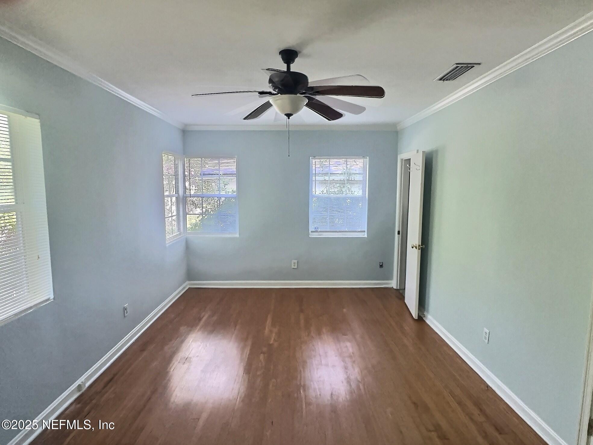 4253 Roma Boulevard Jacksonville, FL 32210 - Photo 8 of 17 a view of empty room with wooden floor and fan