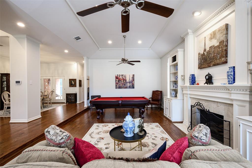 6822 Meadow Road Dallas, TX 75230 - Photo 19 of 35 Italian Marble FP, Built in Bookshelves, high ceilings, wood floors.