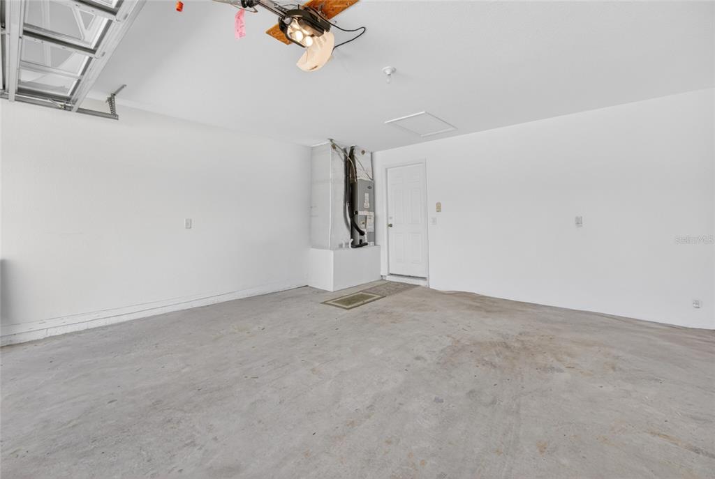 6032 Southwest 103rd Loop Ocala, FL 34476 - Photo 19 of 28 a view of a room with rack and air conditioner duct