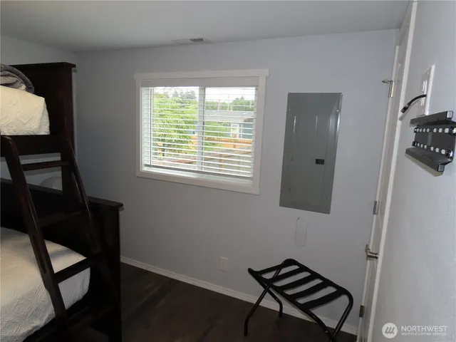 a room that has a bed and a window in it