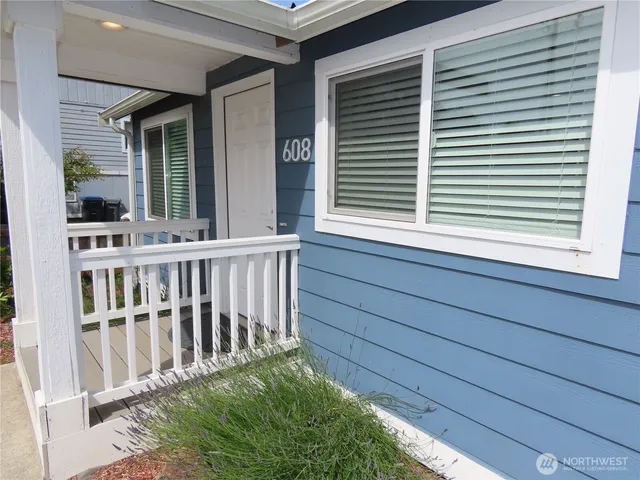 a view of a house with porch and wooden floor