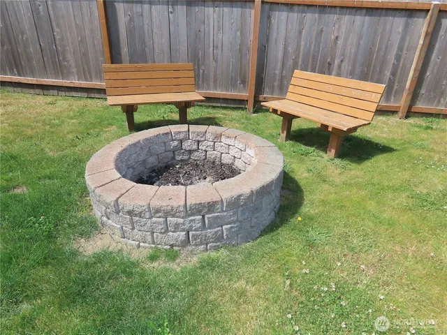a view of a bench in a backyard
