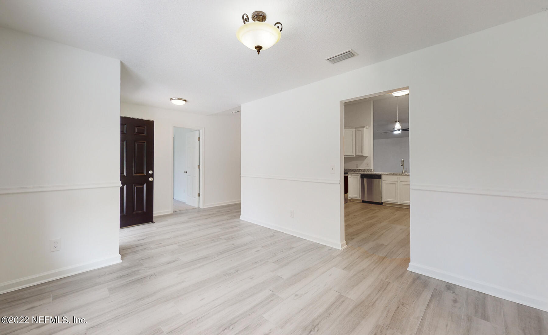 745 Ebb Tide Drive Fleming Island, FL 32003 - Photo 11 of 38 wooden floor in an empty room with a window