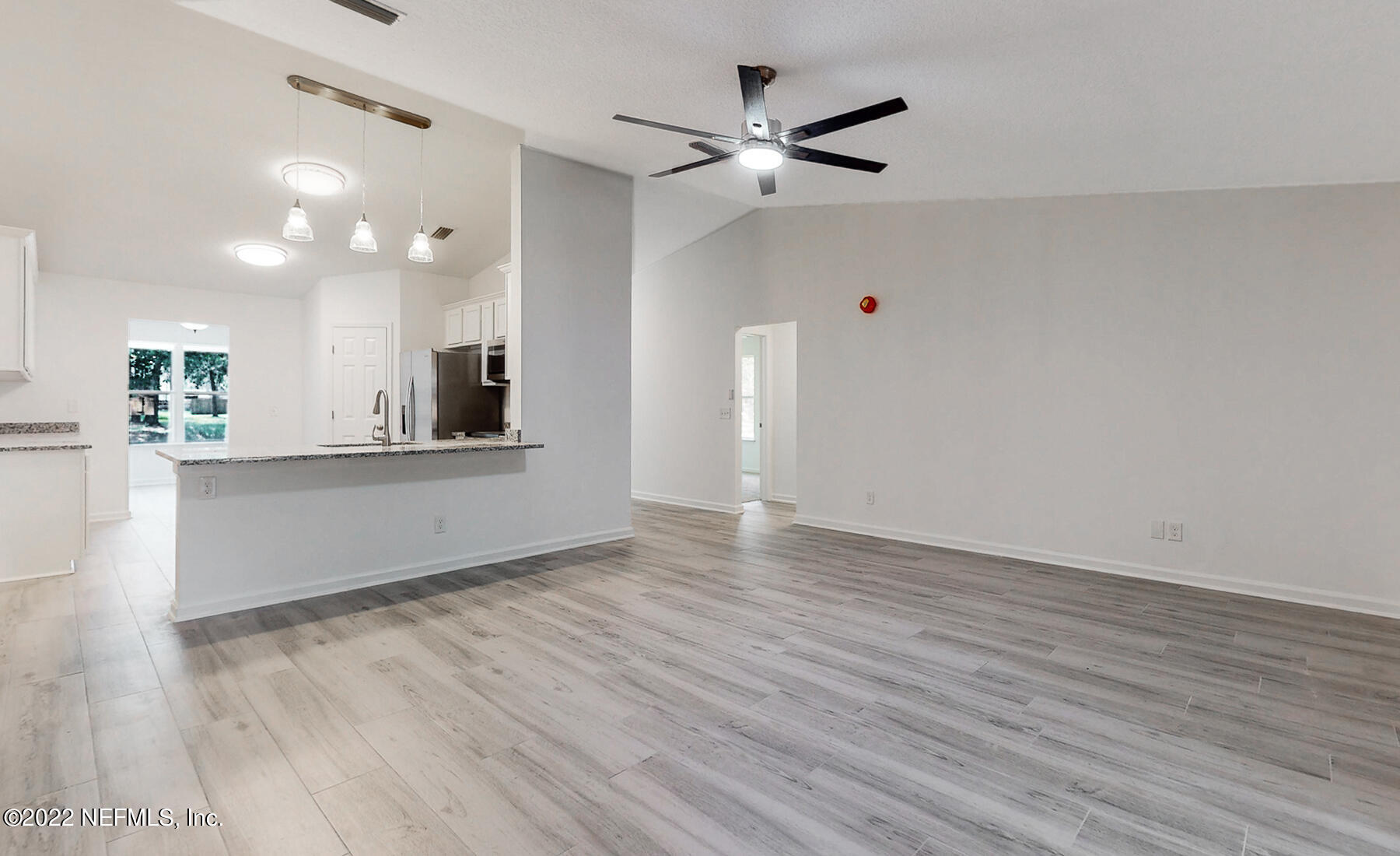 745 Ebb Tide Drive Fleming Island, FL 32003 - Photo 16 of 38 a view of a kitchen with a dishwasher and a large window