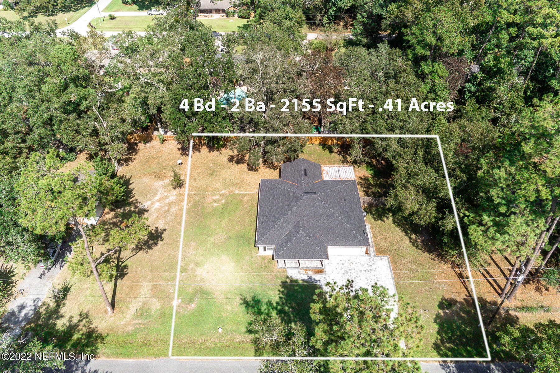745 Ebb Tide Drive Fleming Island, FL 32003 - Photo 2 of 38 an aerial view of a house with a yard and lake view