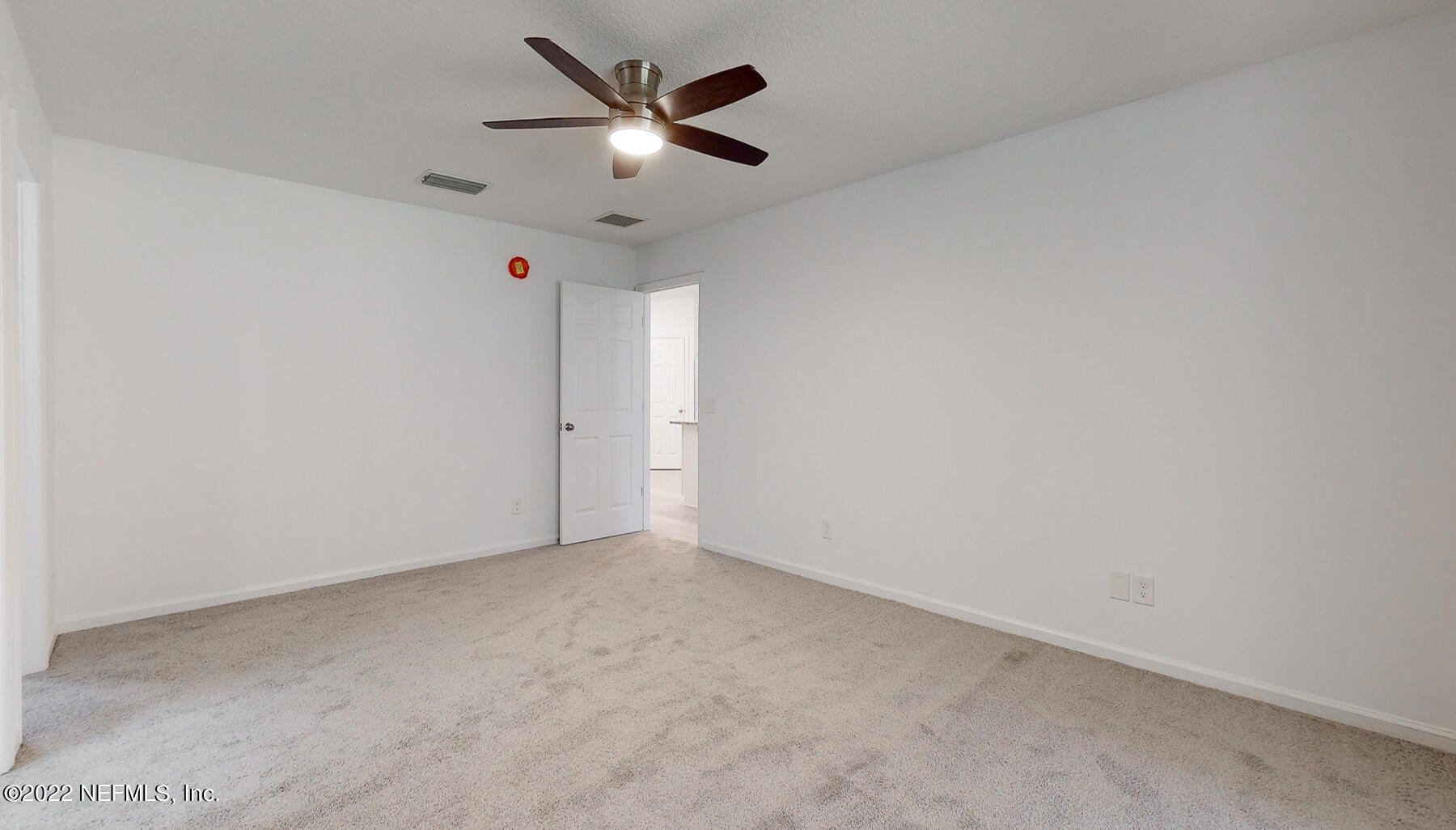 745 Ebb Tide Drive Fleming Island, FL 32003 - Photo 22 of 38 an empty room with a ceiling fan and window