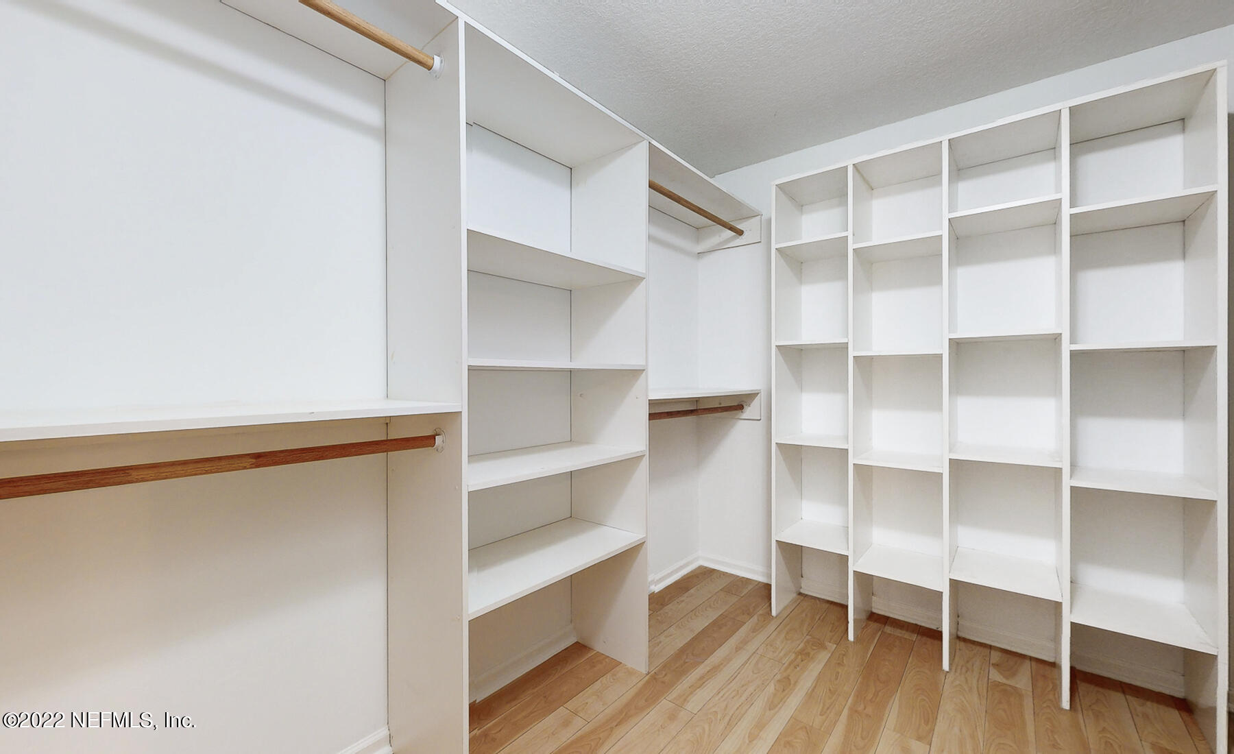 745 Ebb Tide Drive Fleming Island, FL 32003 - Photo 23 of 38 a view of walk in closet with empty racks