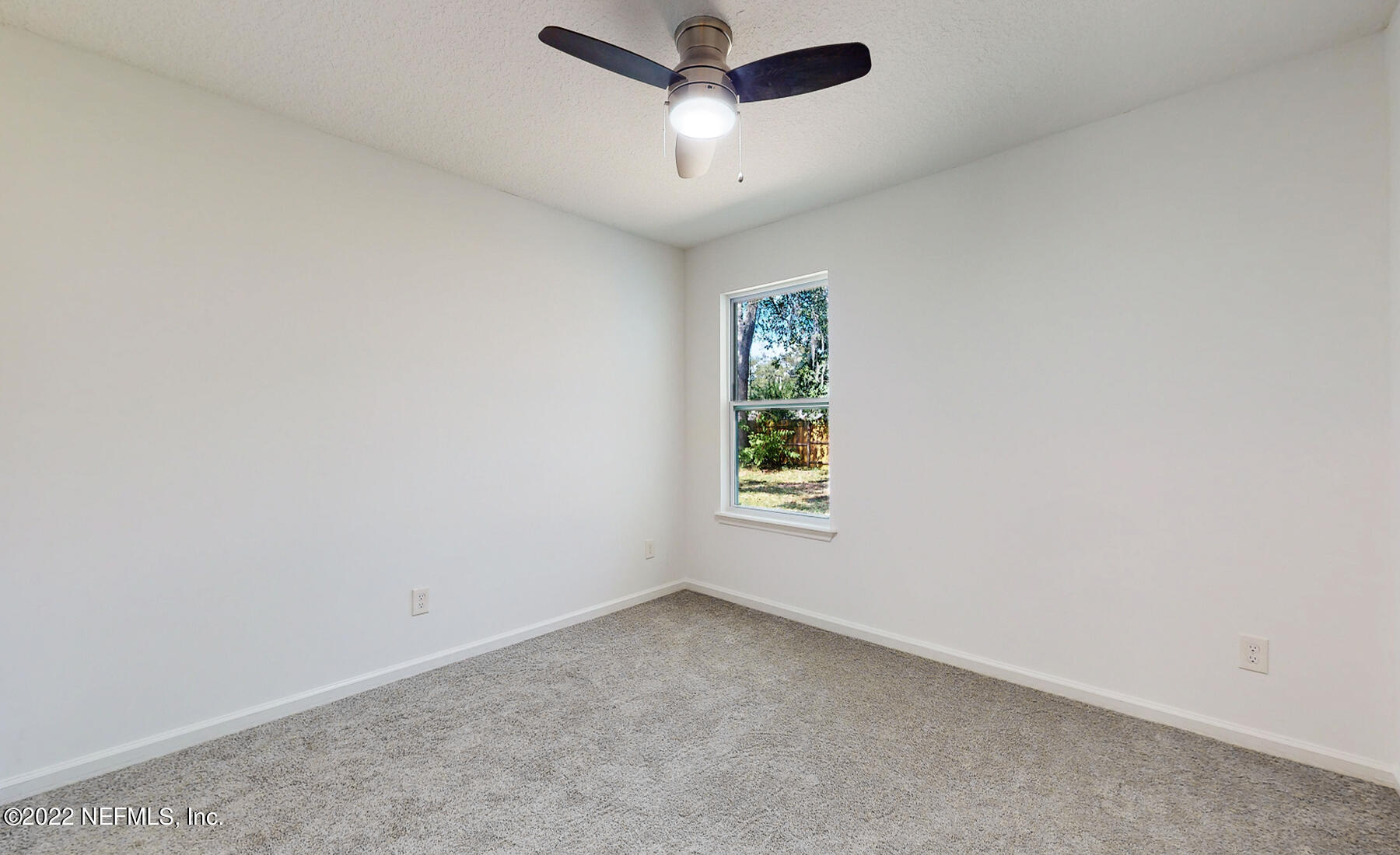745 Ebb Tide Drive Fleming Island, FL 32003 - Photo 30 of 38 an empty room with a window and a fan