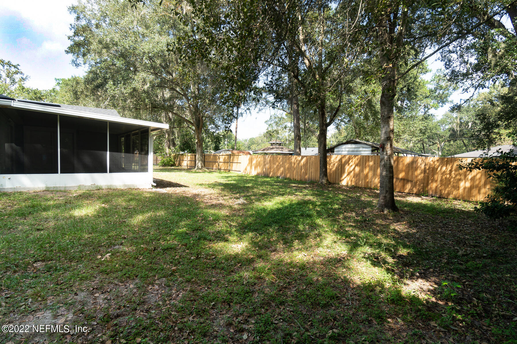 745 Ebb Tide Drive Fleming Island, FL 32003 - Photo 34 of 38 a swimming pool with outdoor seating and yard