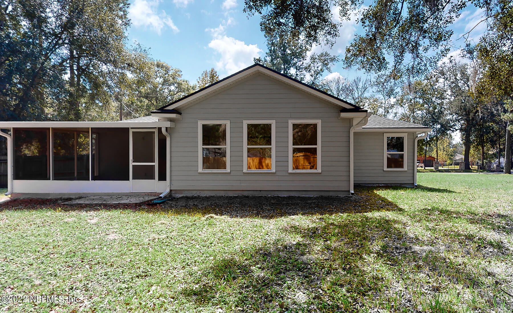 745 Ebb Tide Drive Fleming Island, FL 32003 - Photo 35 of 38 a view of a house with yard and tree s