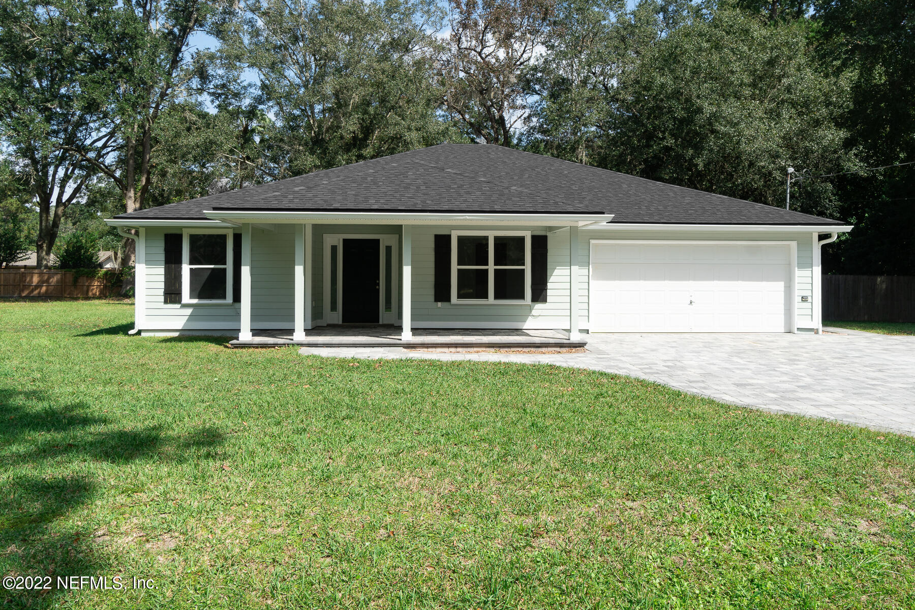 745 Ebb Tide Drive Fleming Island, FL 32003 - Photo 4 of 38 front view of a house with a yard