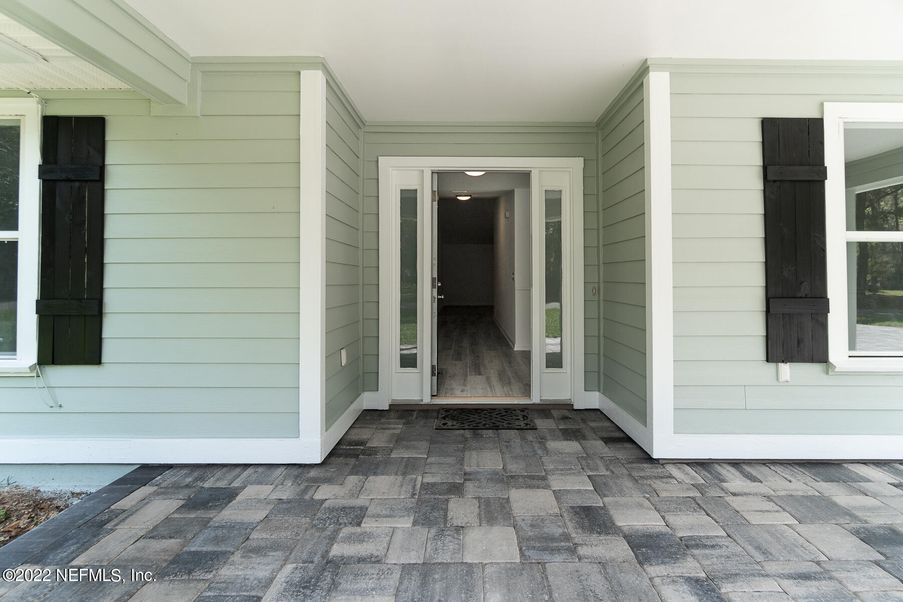 745 Ebb Tide Drive Fleming Island, FL 32003 - Photo 6 of 38 a view of a door of a house with a large window