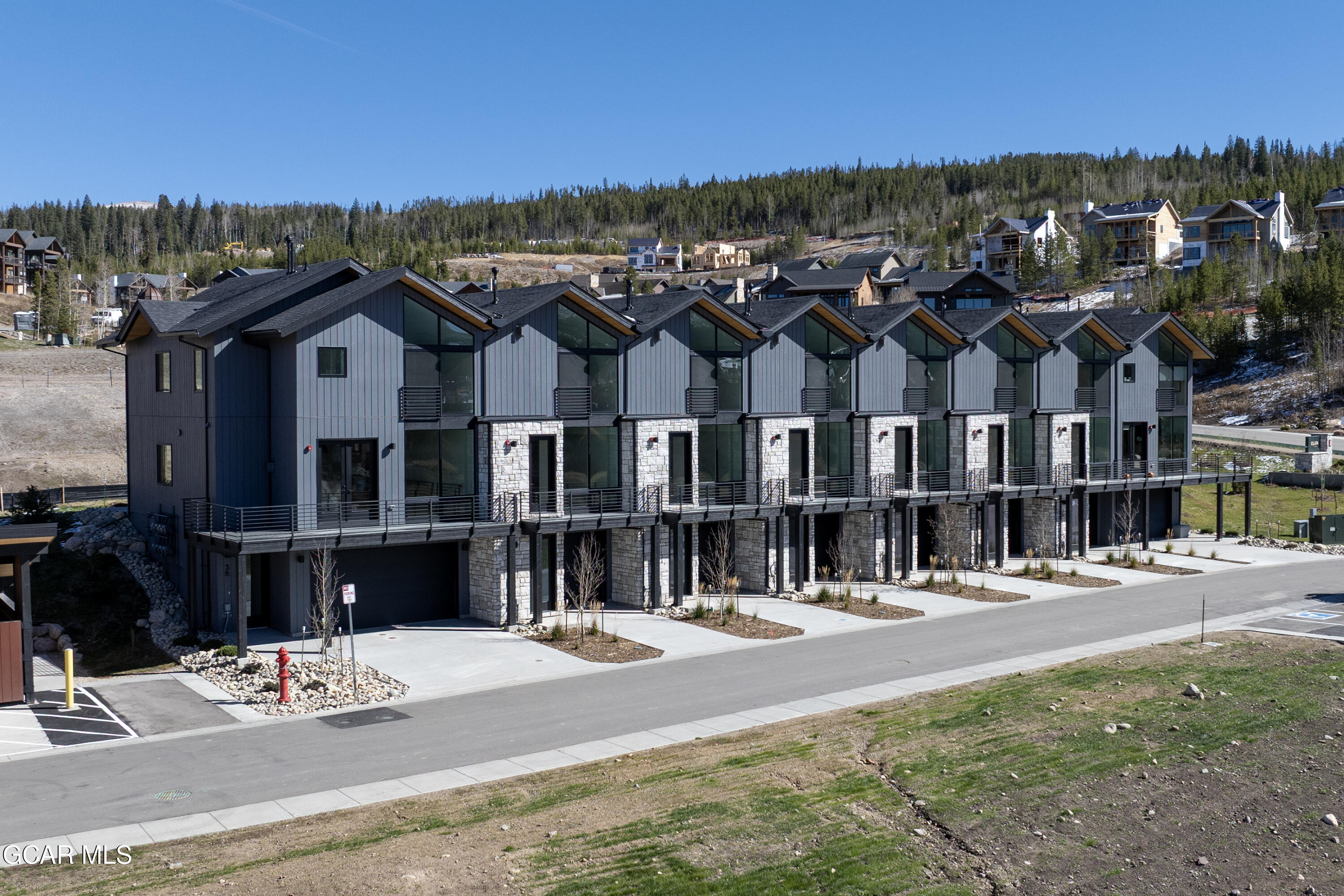 20 Wheeler Road Winter Park, CO 80482 - Photo 1 of 39 a view of a big house with a big yard and large trees