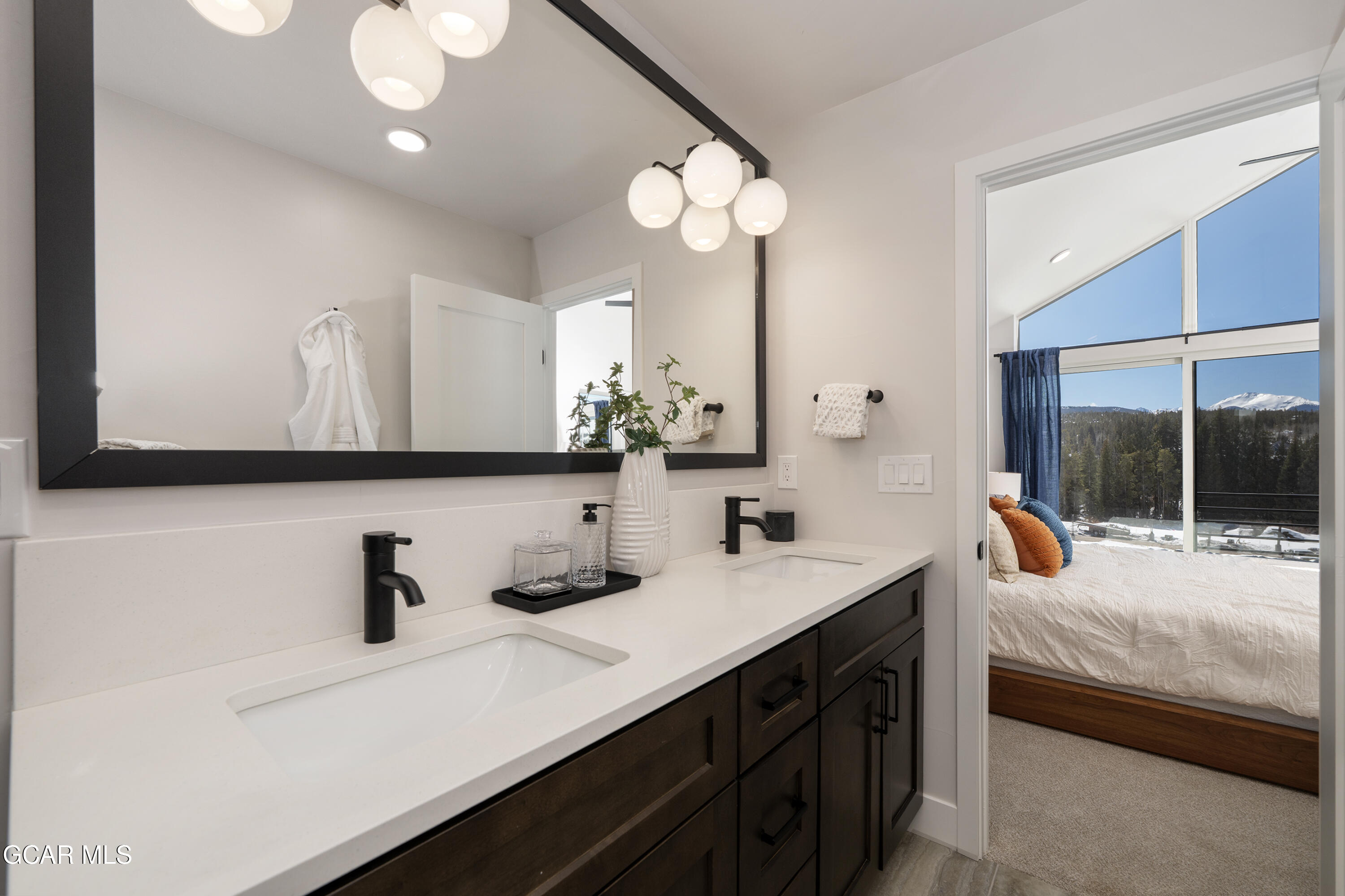 20 Wheeler Road Winter Park, CO 80482 - Photo 20 of 39 a bathroom with a sink double vanity and a mirror