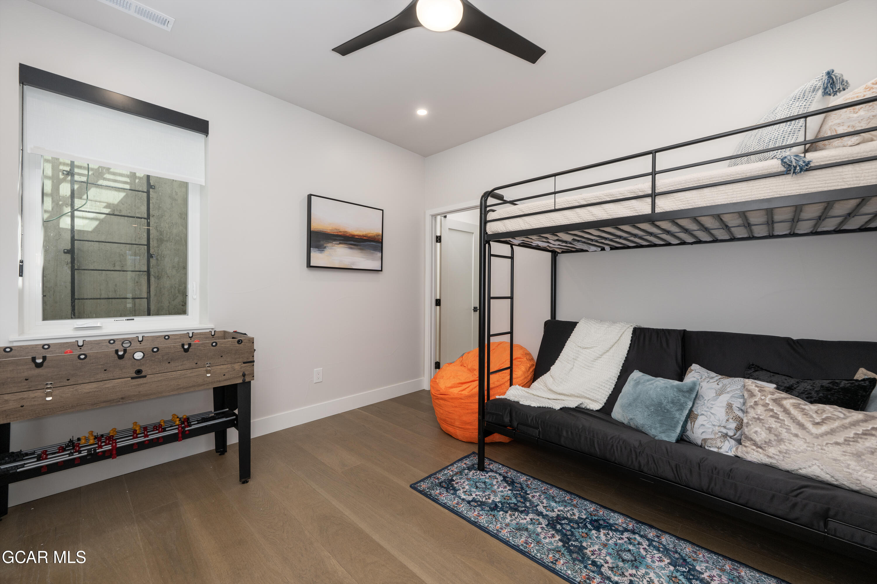 20 Wheeler Road Winter Park, CO 80482 - Photo 28 of 39 a bedroom with furniture and wooden floor