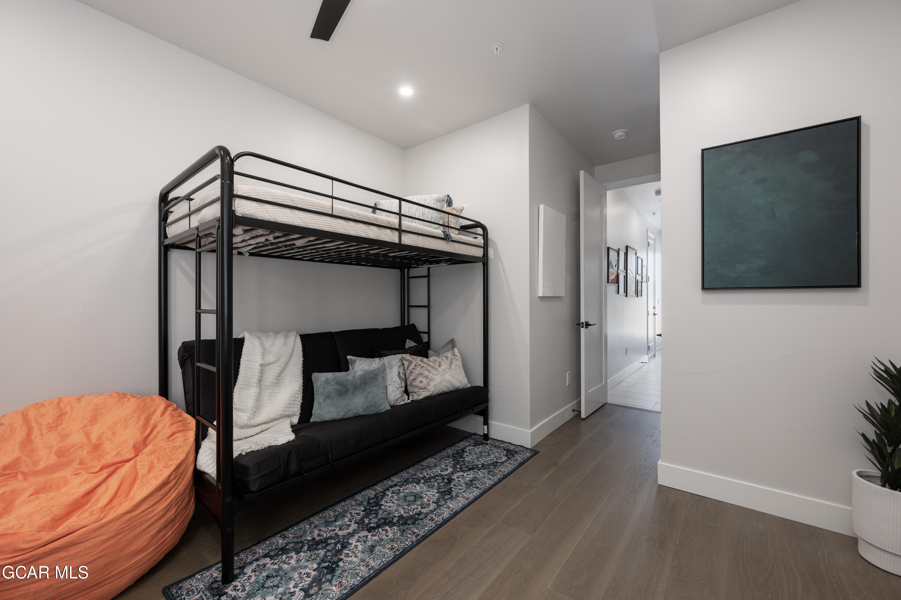 20 Wheeler Road Winter Park, CO 80482 - Photo 29 of 39 a bedroom with a bed and a flat tv screen on wall
