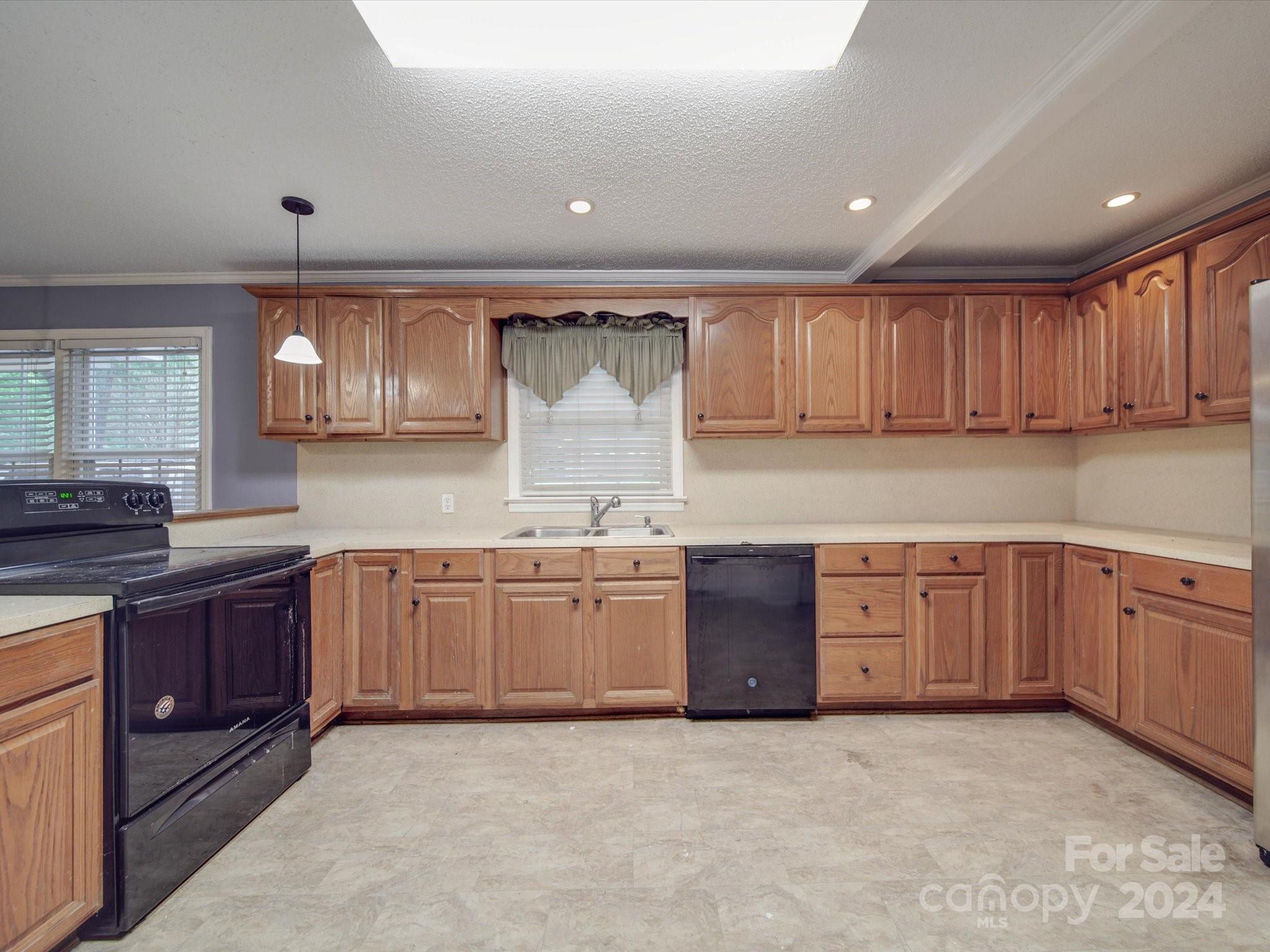 20082 Coley Store Road Locust, NC 28097 - Photo 11 of 43 a kitchen with stainless steel appliances granite countertop a sink stove and cabinets