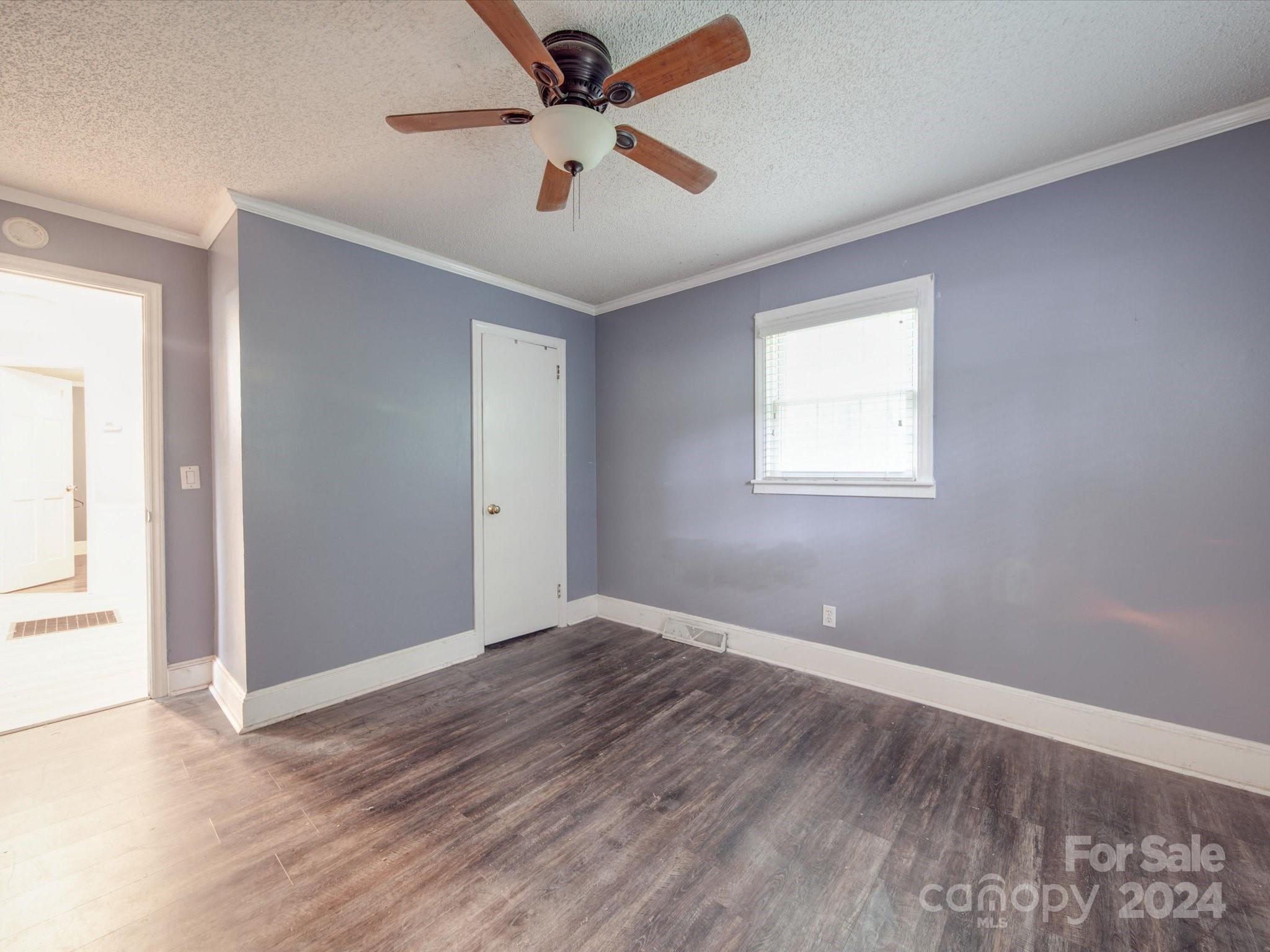 20082 Coley Store Road Locust, NC 28097 - Photo 16 of 43 wooden floor in an empty room with a window