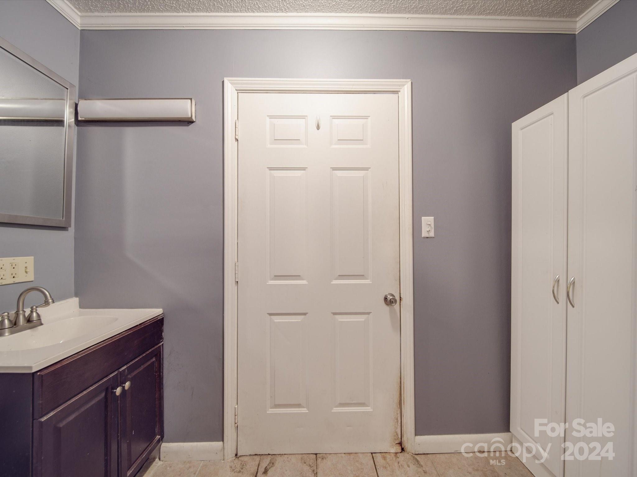 20082 Coley Store Road Locust, NC 28097 - Photo 24 of 43 a bathroom with a shower sink vanity and mirror