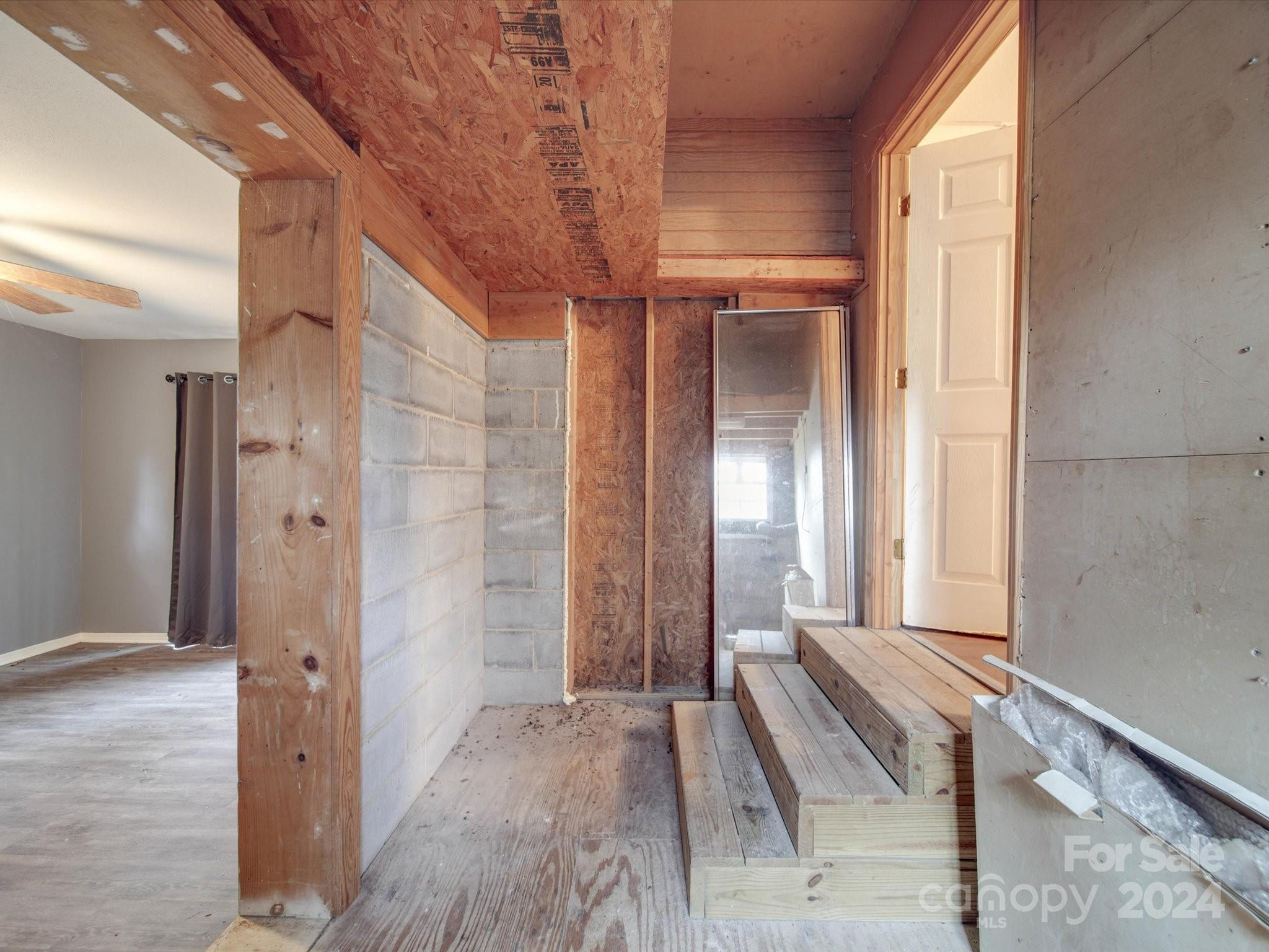 20082 Coley Store Road Locust, NC 28097 - Photo 29 of 43 a view of a room with wooden floor and windows