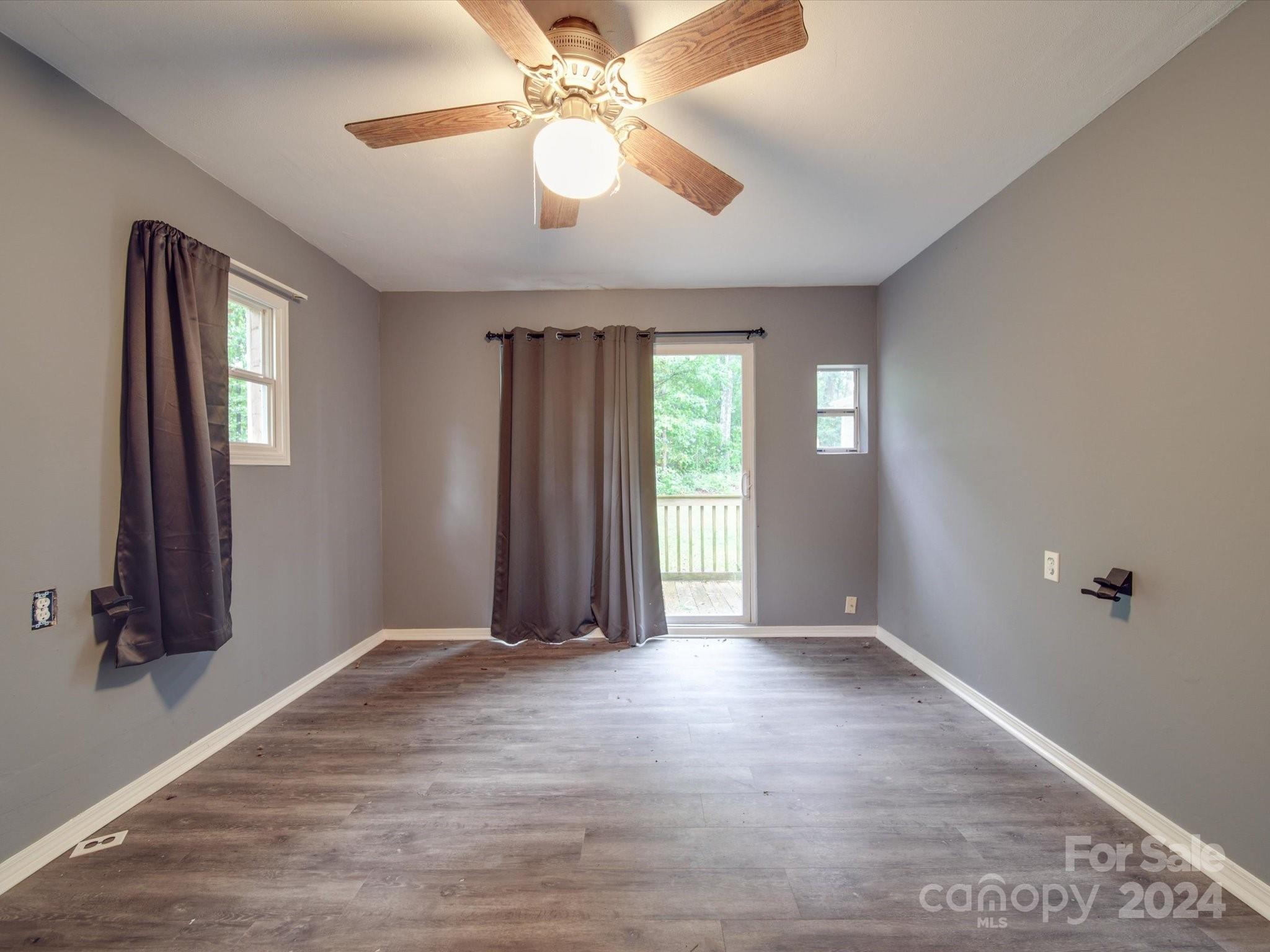 20082 Coley Store Road Locust, NC 28097 - Photo 32 of 43 wooden floor in an empty room with a window
