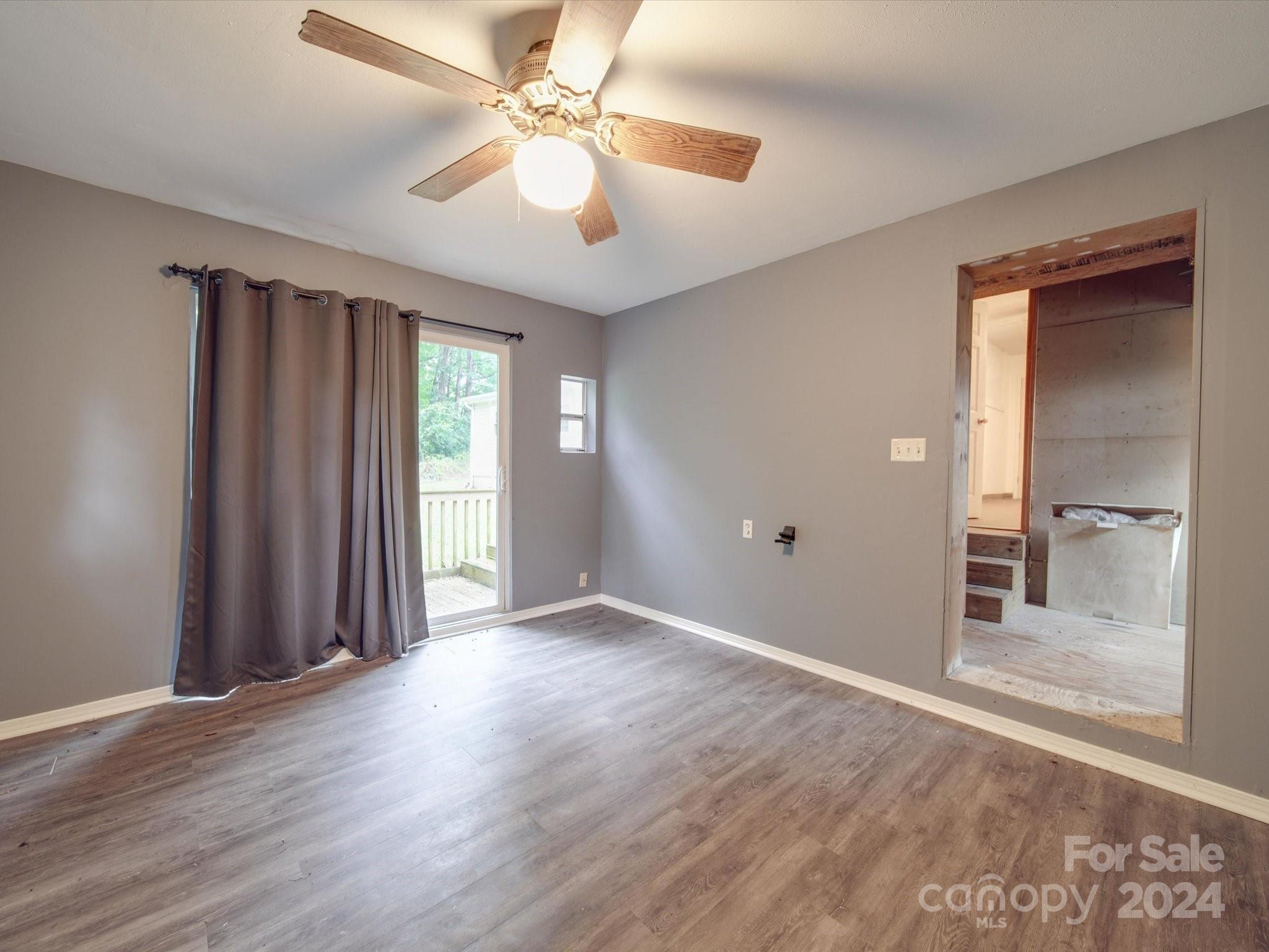 20082 Coley Store Road Locust, NC 28097 - Photo 33 of 43 wooden floor in an empty room with a window