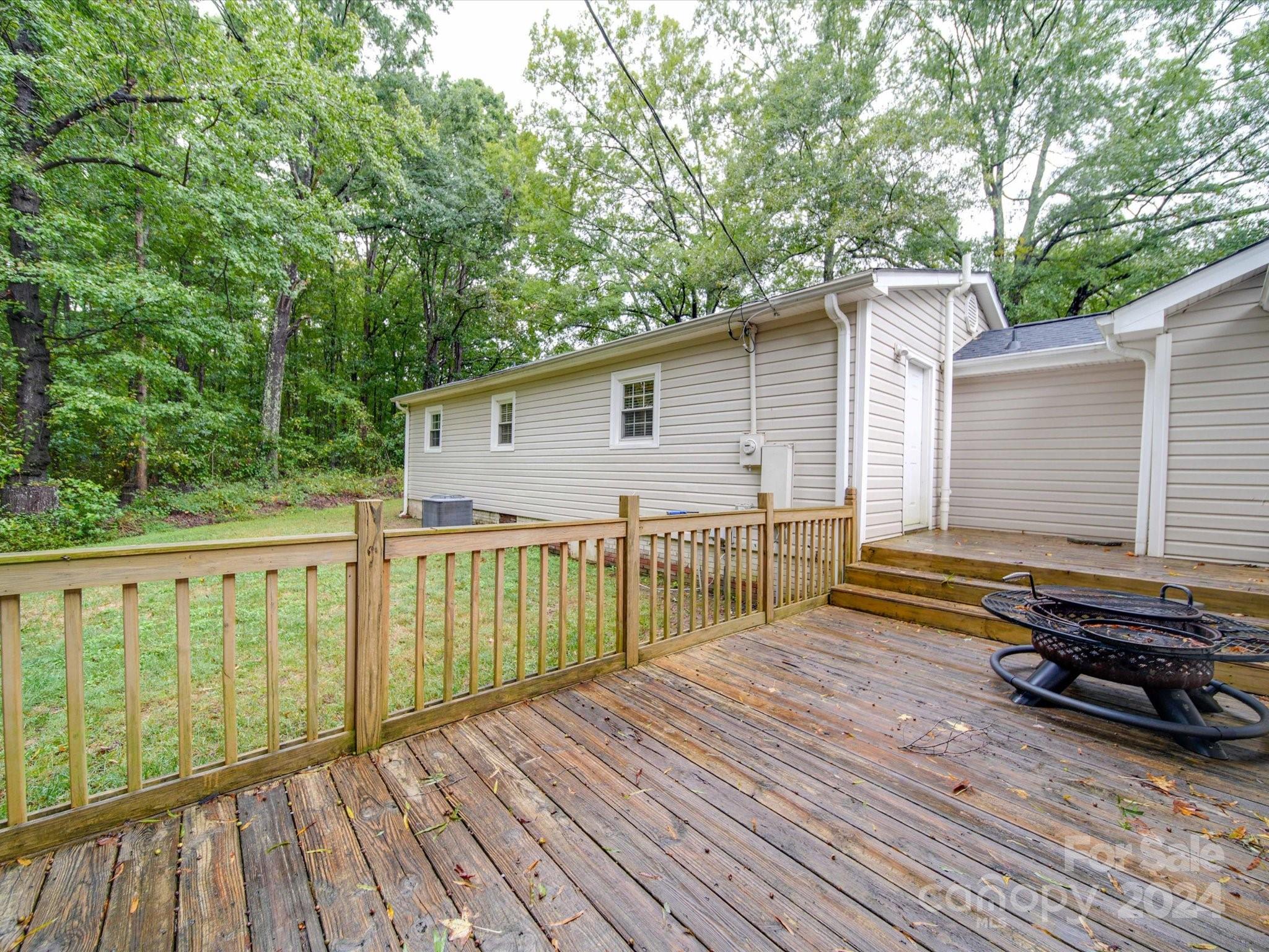 20082 Coley Store Road Locust, NC 28097 - Photo 37 of 43 a view of a house with a wooden deck