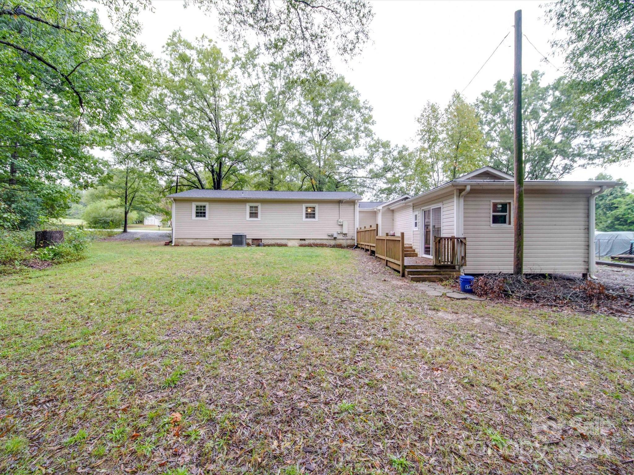 20082 Coley Store Road Locust, NC 28097 - Photo 40 of 43 a view of a house with backyard and a tree