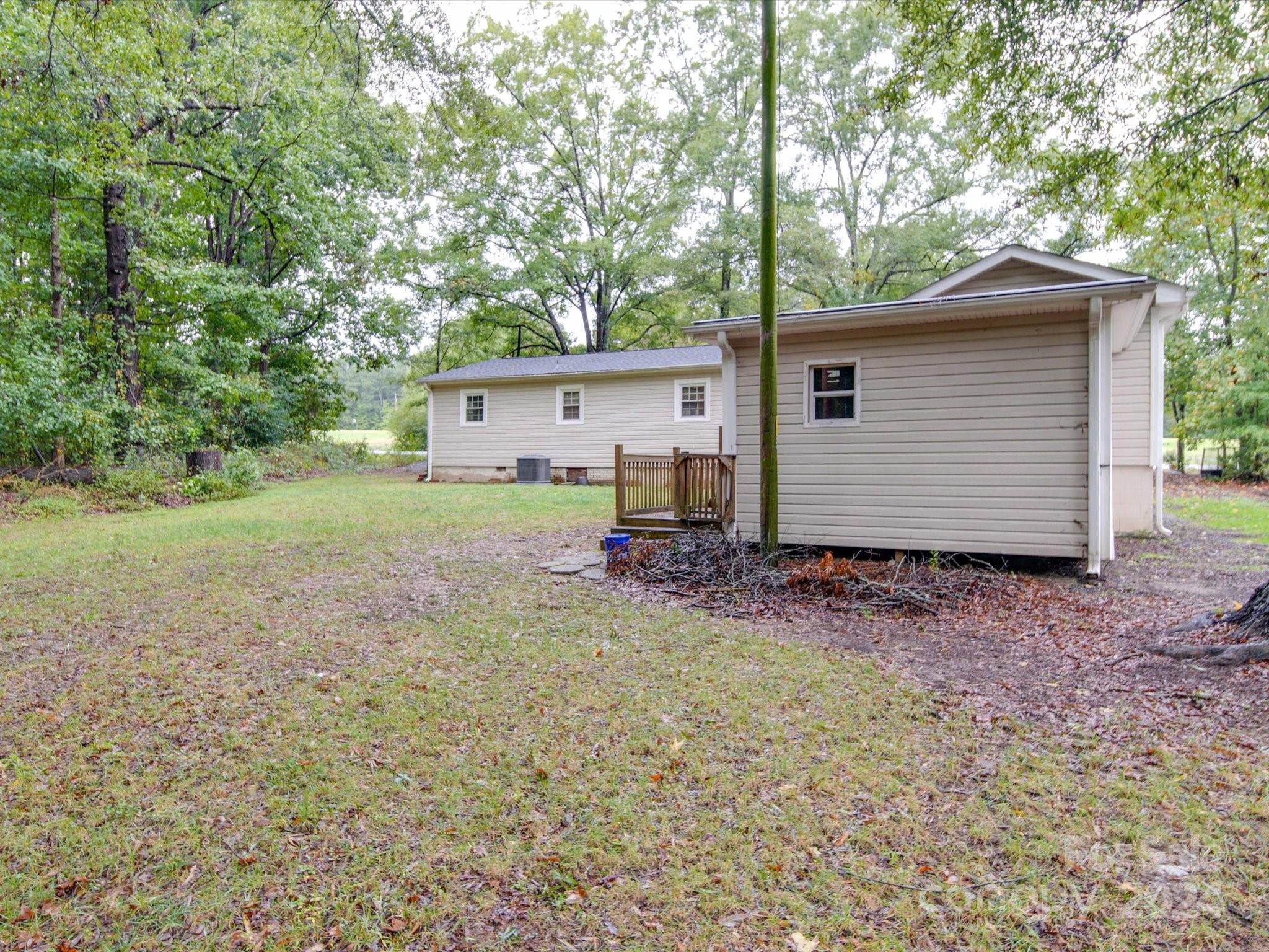 20082 Coley Store Road Locust, NC 28097 - Photo 41 of 43 a view of backyard of house and car parked
