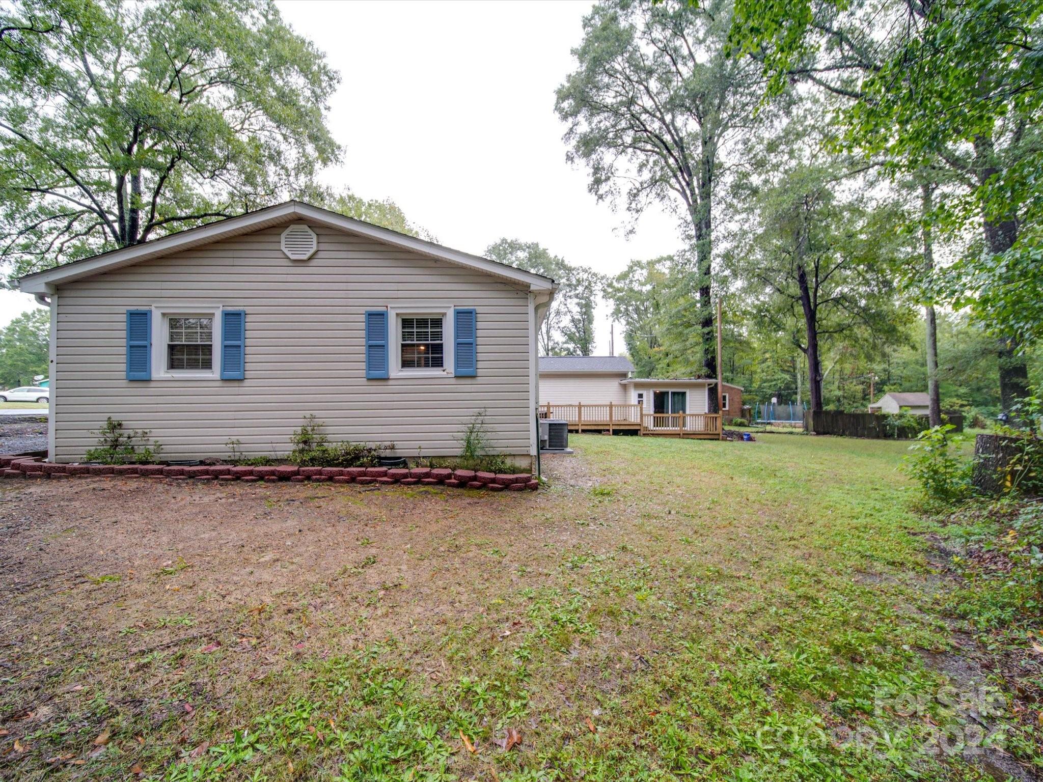 20082 Coley Store Road Locust, NC 28097 - Photo 42 of 43 a brick house with trees in front of it