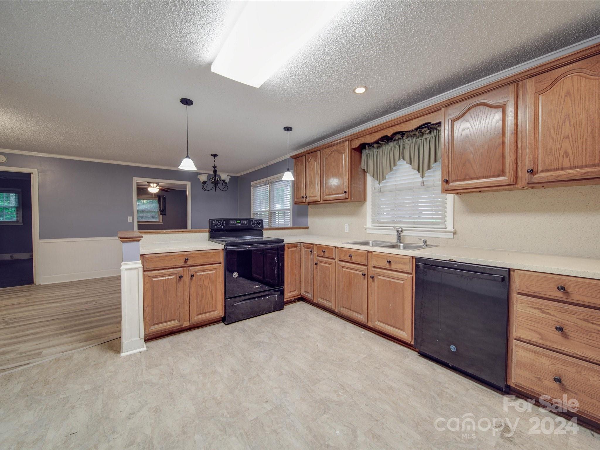 20082 Coley Store Road Locust, NC 28097 - Photo 10 of 43 a large kitchen with stainless steel appliances kitchen island granite countertop a sink and cabinets