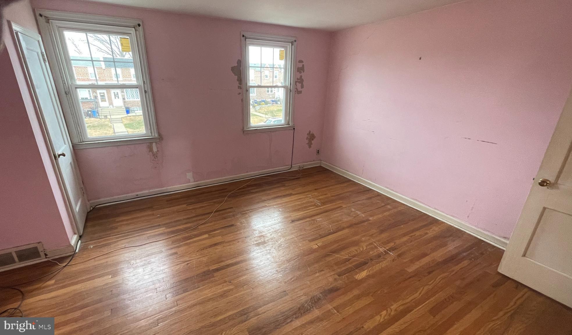 3042 Fairfield Street Philadelphia, PA 19136 - Photo 12 of 23 an empty room with wooden floor and windows