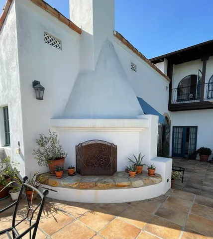 a view of a house with iron fence