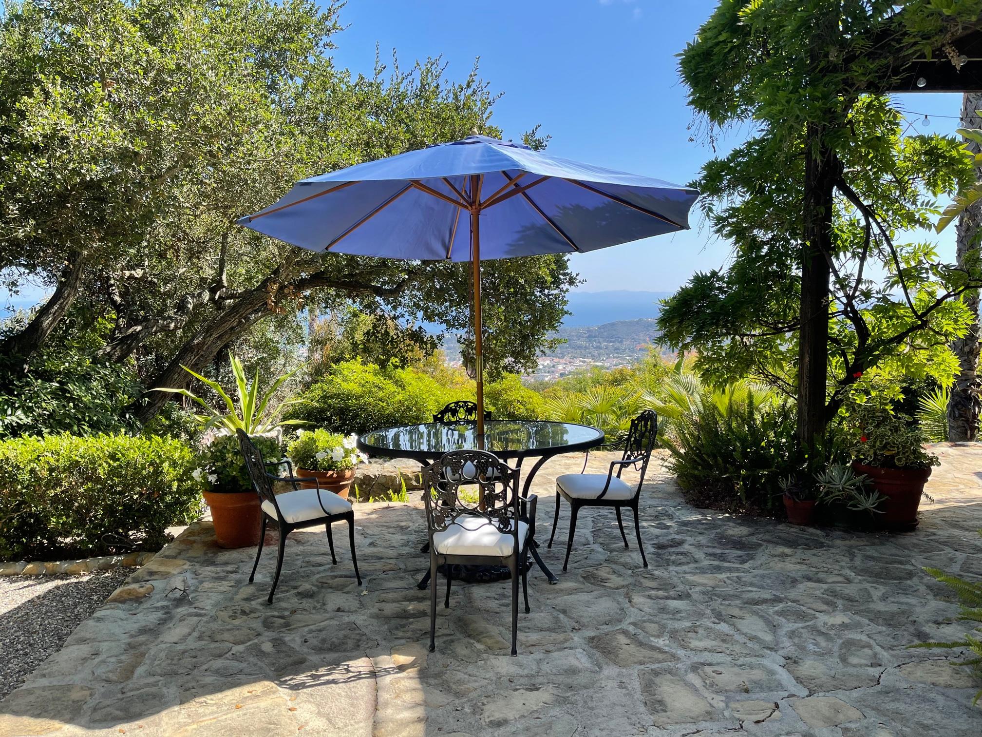 0 Mission Ridge Road Santa Barbara, CA 93103 - Photo 15 of 71 a view of patio with chairs and table under an umbrella