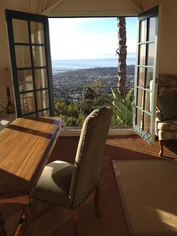 a patio with tables and chairs