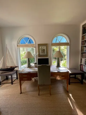 a view of a lake in between the bunch of trees