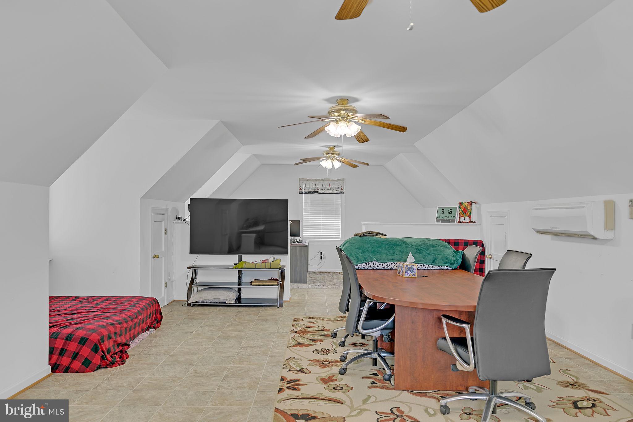 1887 Point Breeze Road Hudgins, VA 23076 - Photo 77 of 77 a living room with furniture and a flat screen tv