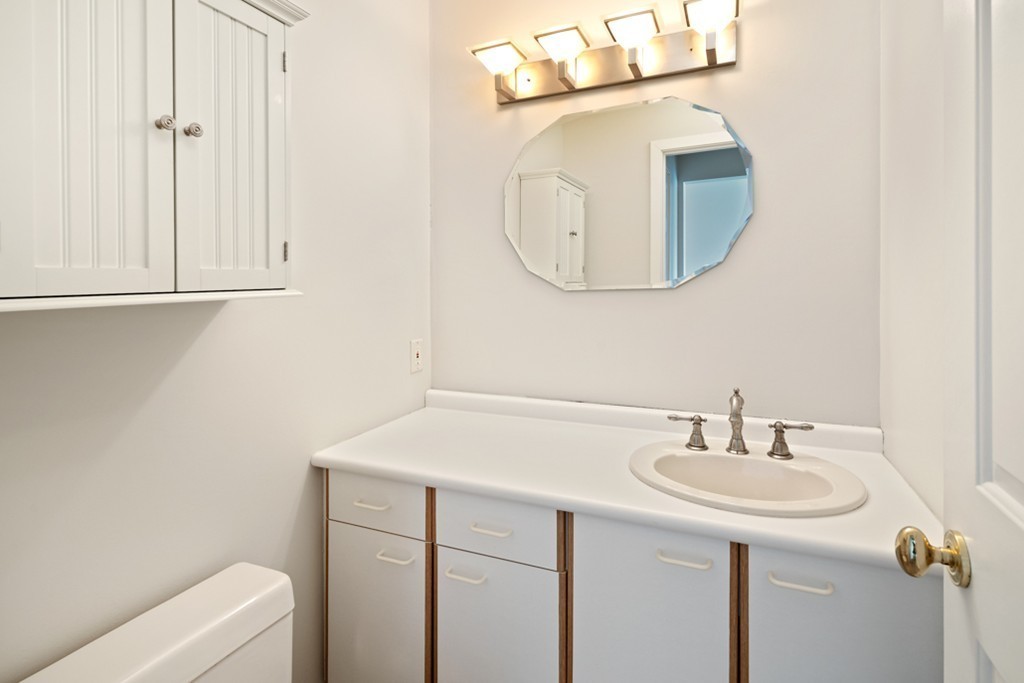 2 Marina Drive, Unit 2 Hull, MA 02045 - Photo 11 of 30 a bathroom with a sink and a mirror