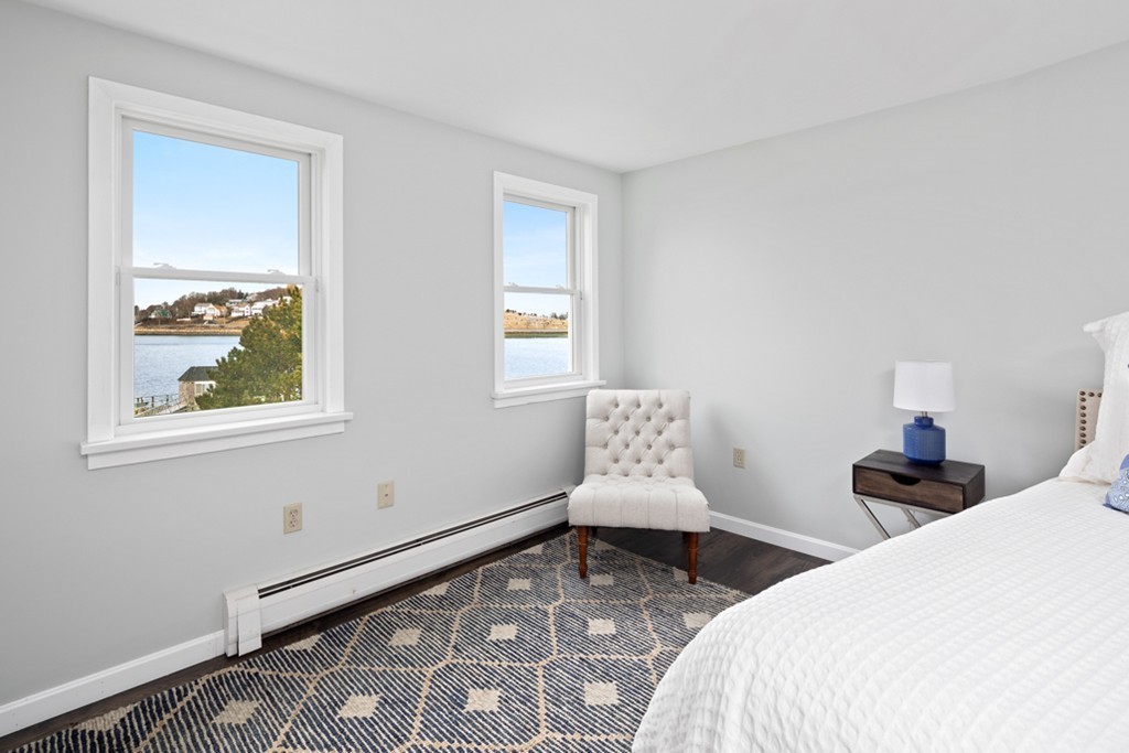 2 Marina Drive, Unit 2 Hull, MA 02045 - Photo 17 of 30 a bedroom with a bed and a window