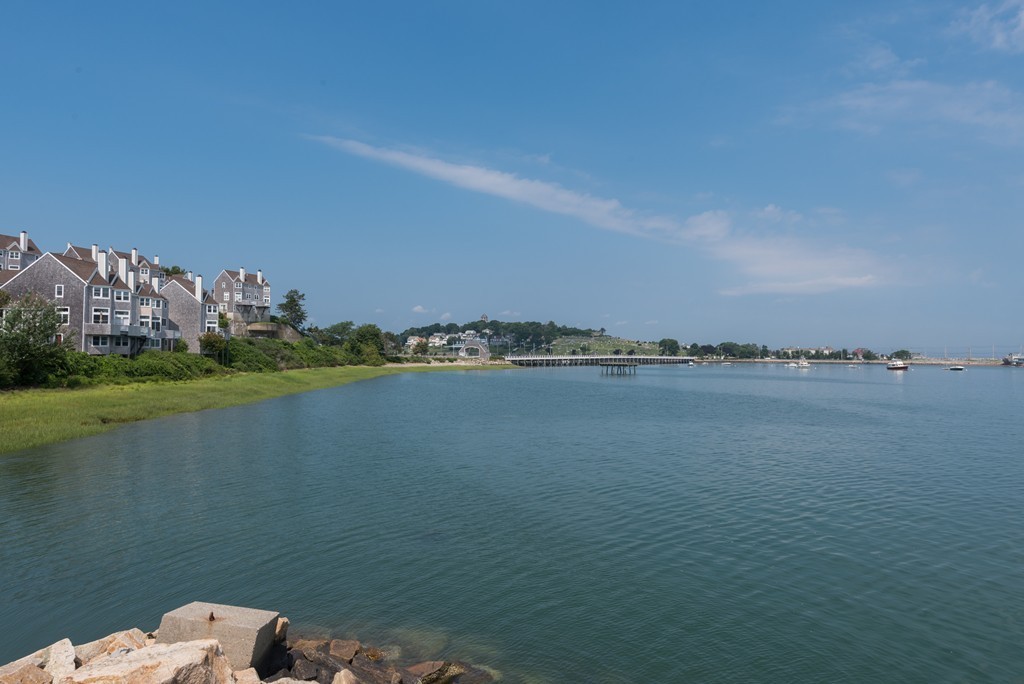 2 Marina Drive, Unit 2 Hull, MA 02045 - Photo 23 of 30 a view of a lake with a big yard