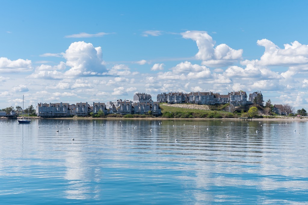 2 Marina Drive, Unit 2 Hull, MA 02045 - Photo 25 of 30 a view of an ocean with boats and trees in the background