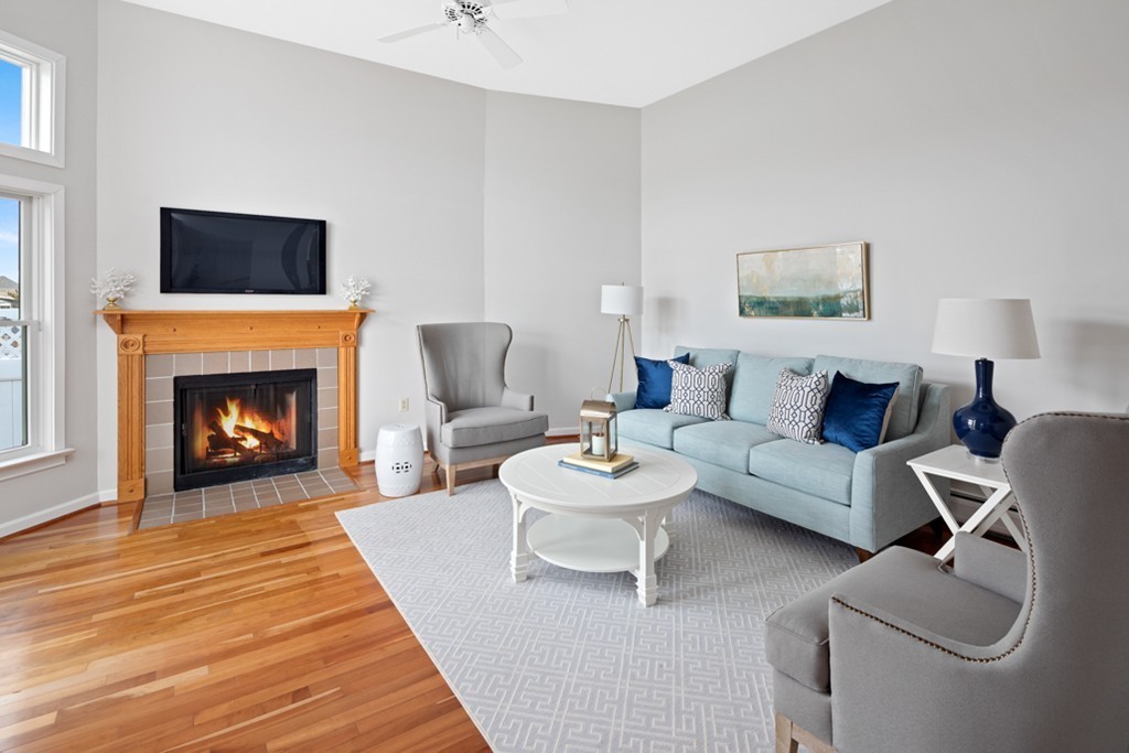 2 Marina Drive, Unit 2 Hull, MA 02045 - Photo 3 of 30 a living room with furniture and a fireplace