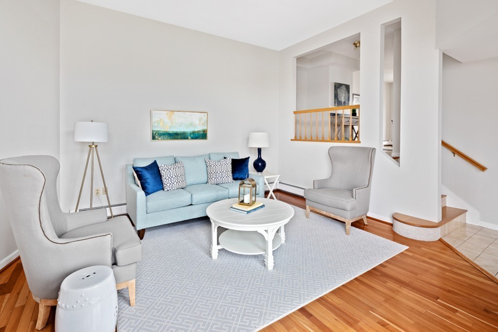 2 Marina Drive, Unit 2 Hull, MA 02045 - Photo 4 of 30 a living room with furniture and a wooden floor