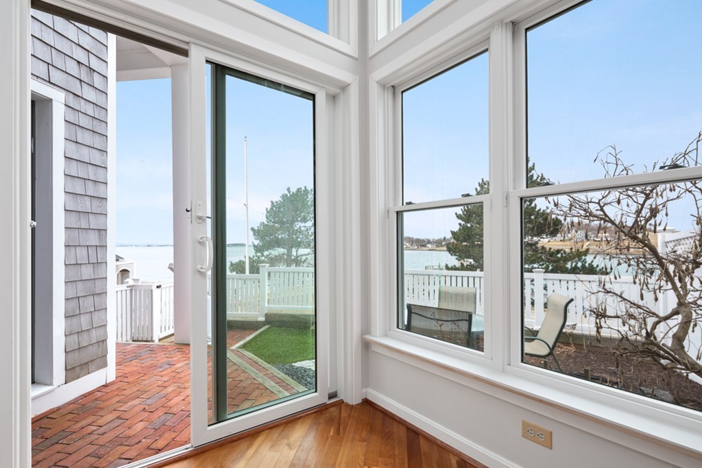 2 Marina Drive, Unit 2 Hull, MA 02045 - Photo 5 of 30 a view of a glass door with a from balcony