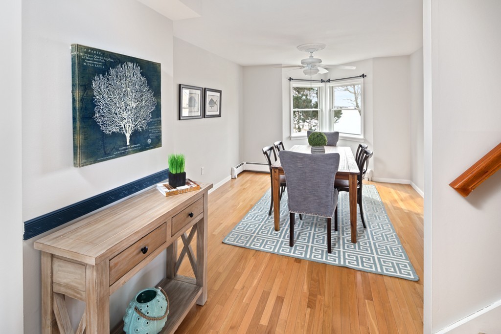2 Marina Drive, Unit 2 Hull, MA 02045 - Photo 7 of 30 a view of a dining room with furniture a potted plant and wooden floor