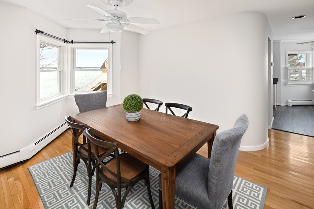 2 Marina Drive, Unit 2 Hull, MA 02045 - Photo 8 of 30 a view of a dining room with furniture and wooden floor