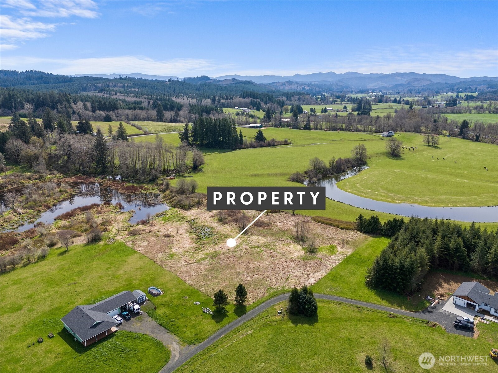 0 X Lilly Wheaton Road Raymond, WA 98577 - Photo 11 of 14 an aerial view of a house with a garden